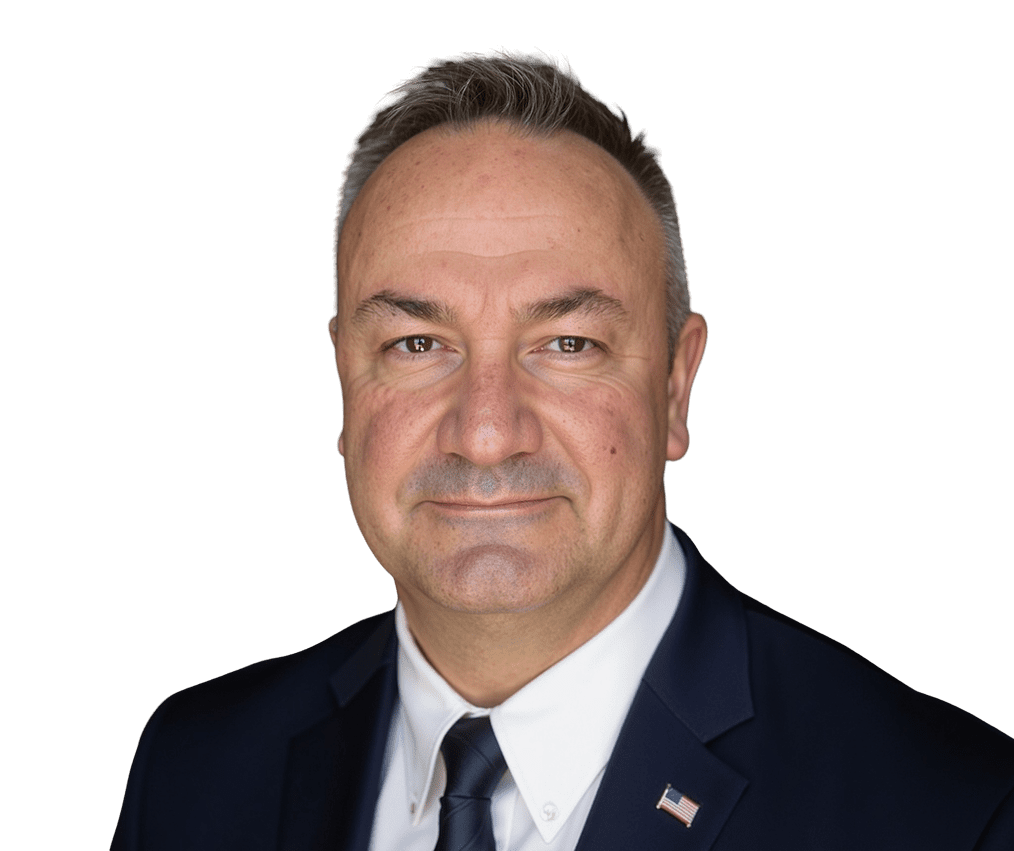 Man in suit with American flag pin.